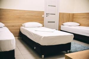 Кровать или кровати в номере Отель Квартал