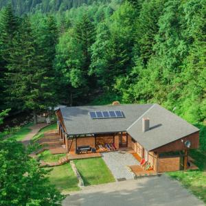 an overhead view of a house with a solar roof at Novosiele Lifestyle Apartments in Bystre