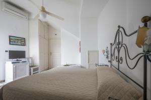 Postel nebo postele na pokoji v ubytování Hotel Gennarino A Mare + 22 fotografií