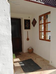 a room with a door and a rug on the floor at Traditionelles Bauernhaus Flieder in Zalaszentgrót