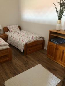 Posteľ alebo postele v izbe v ubytovaní Apartman Tapolca Belváros