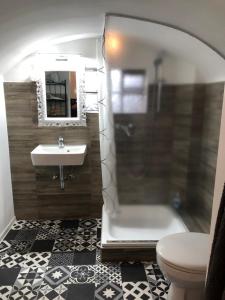 a bathroom with a sink and a toilet and a shower at East-Village-No5 Bremen in Bremen