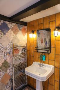 a bathroom with a sink and a mirror at The Turks Head in Exeter
