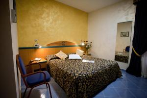 Voodi või voodid majutusasutuse Hotel Talao toas