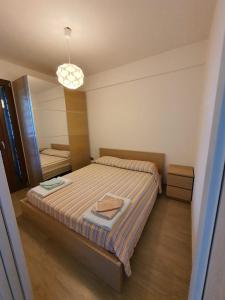 A bed or beds in a room at Villetta Torre Saracena