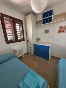 A bed or beds in a room at Villetta Torre Saracena