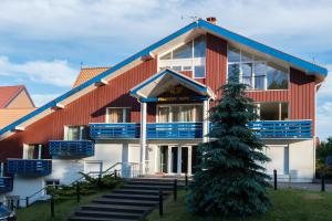 a building with a christmas tree in front of it at Parnidžio Kopa in Nida