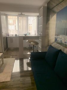 a living room with a couch and a kitchen at MariSole in Constanţa +41 photos