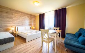 Posteľ alebo postele v izbe v ubytovaní Apartmány Karmon Park