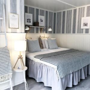 Ένα ή περισσότερα κρεβάτια σε δωμάτιο στο Eco by StrandNära