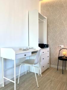 a white desk with a chair and a dresser in a room at Le Calette House - Puglia Mia Apartments in Monopoli