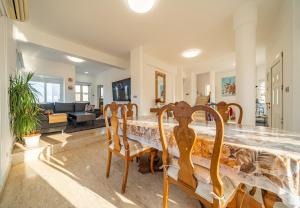 a dining room with a table and chairs at Dene Hollow Oroklini in Voroklini
