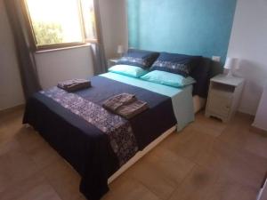 Posteľ alebo postele v izbe v ubytovaní Poggio ai Grilli Apartment