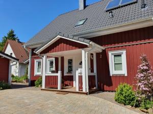 a red house with a red roof at Haus Nordlicht in Horn-Bad Meinberg