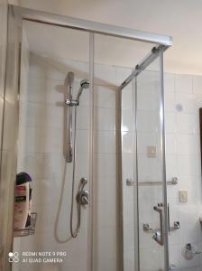 a shower with a glass door in a bathroom at CASA SIRENETTA-Little Mermaid House in Lentini
