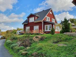 a red house with a black roof at Haus Nordlicht in Horn-Bad Meinberg