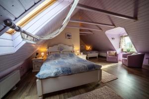 a bedroom with a bed in a attic at Casa cu Suflet in Sighişoara