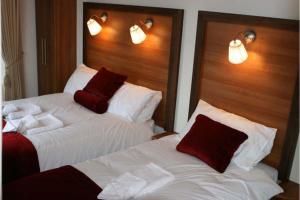Letto o letti in una camera di Ravine Hotel