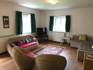 a living room with two chairs and a couch at LA GRANGE in Saint-Prix-lès-Arnay