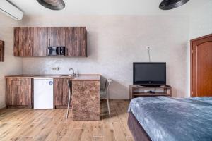 Kuchyň nebo kuchyňský kout v ubytování Boomerang apart-apart hotel