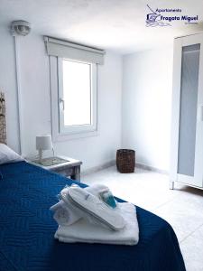 Posteľ alebo postele v izbe v ubytovaní APARTAMENTO FRAGATA - LA GRACIOSA