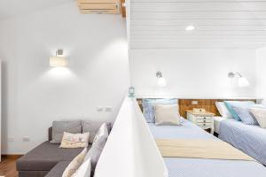 Posteľ alebo postele v izbe v ubytovaní ARGUINEGUIN, BUNGALOWS LOS CANARIOS