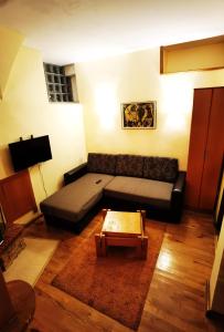 a living room with a couch and a coffee table at St. Varvara Apartments in Ohrid