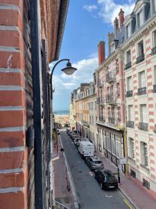 a view of a street from a building at La Petite Sirène in Trouville-sur-Mer