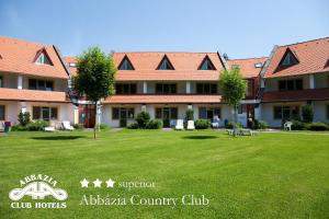 a large building with a lawn in front of it at Abbazia Country Club in Nemesnép +57 photos
