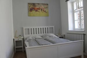 Postel nebo postele na pokoji v ubytování Zwinger Apartman