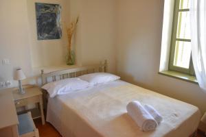 A bed or beds in a room at Stone House Kleio Kos