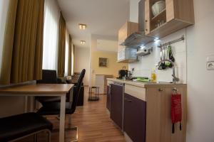 Кухня или кухненски бокс в City Appartements Weiz