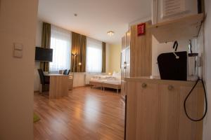 Televízia a/alebo spoločenská miestnosť v ubytovaní City Appartements Weiz