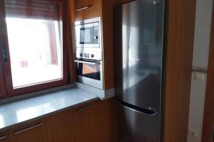 Zdjęcie z galerii obiektu Ático céntrico y funcional con terraza situado frente al Puente de La Toja y al paseo marítimo de O Grove. Ideal para familias o grupos. w mieście O Grove +26 zdjęć