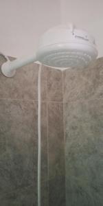 a shower head with water pouring out of it at Boel Boutique Suite en Guayaquil in Guayaquil