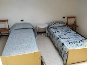 Postel nebo postele na pokoji v ubytování Agriturismo Val di Ferro