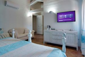 Televisyen dan/atau pusat hiburan di Domus Corallia-Luxury Rooms