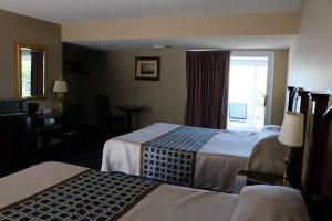 Un pat sau paturi într-o cameră la The Anchor Inn