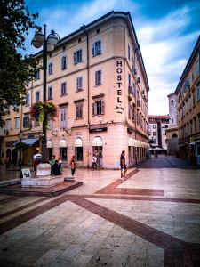 a group of people standing in front of a building at Hostel Kosy in Rijeka