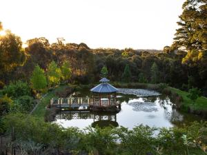a gazebo in the middle of a pond at Churchills - outstanding views over Daylesford in Daylesford +14 photos