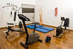 a gym with several exercise bikes in a room at Amérian Hotel Casino Gala in Resistencia