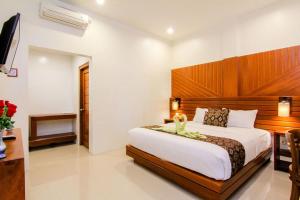 Postel nebo postele na pokoji v ubytování S5 Guest House Yogyakarta