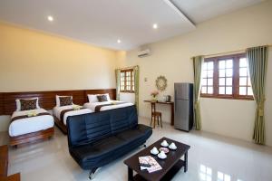 Postel nebo postele na pokoji v ubytování S5 Guest House Yogyakarta