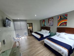 เตียงในห้องที่ Casa Arandas Hotel - Suits