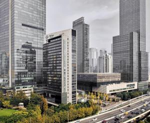 a city with tall buildings and a highway at The Puli Hotel And Spa in Shanghai