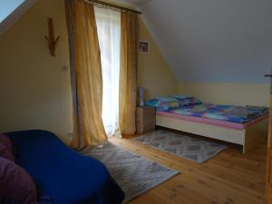 Postel nebo postele na pokoji v ubytování Wilczy Mszaniec + 11 fotografií