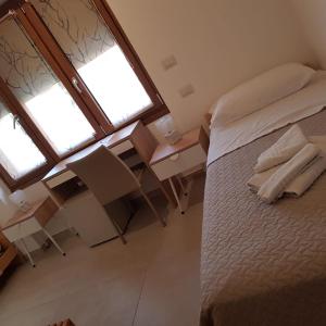 Postel nebo postele na pokoji v ubytování B&B da Mary