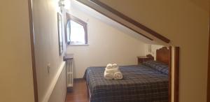Postel nebo postele na pokoji v ubytování LH Albergo il Paradiso