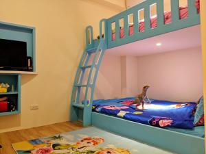 Letto o letti in una camera di 墾丁舍廷親子會館 KT13 Hotel
