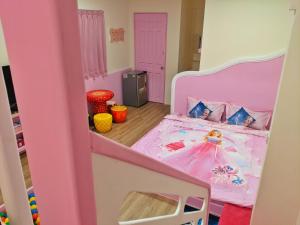 Letto o letti in una camera di 墾丁舍廷親子會館 KT13 Hotel